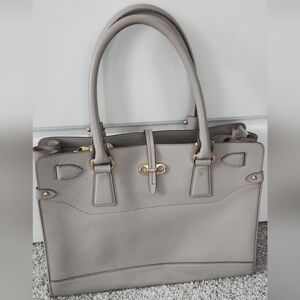 Authentic Salvatore Ferragamo tote in grey with gold accents